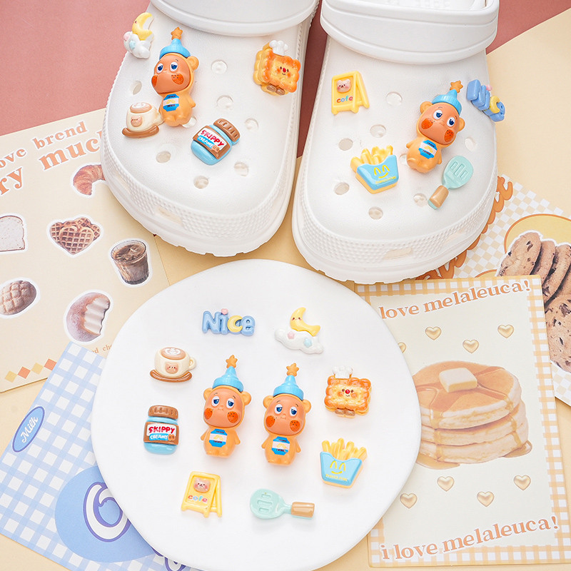 Phụ kiện giày lỗ Pop Mart Bơ đậu phộng Starman Khóa giày Thích hợp cho Crocs Khóa giày giác quan cao cấp có thể tháo rời Khóa giày lỗ Khóa giày Busch Khóa giày Zhibixing ins Hoa giày