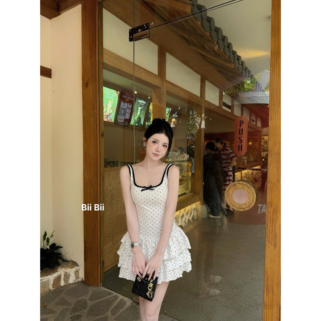 ĐẦM THUN BI 2 DÂY VIỀN ĐÍNH NƠ ĐEN XOÈ TẦNG BYJOLIE