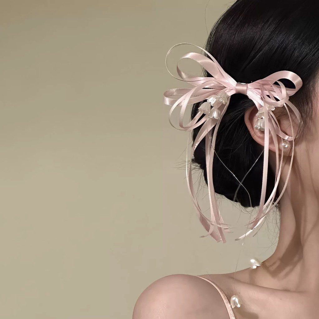 Kẹp tóc hoa huệ màu hồng thanh lịch của thung lũng và nơ dành cho nữ
