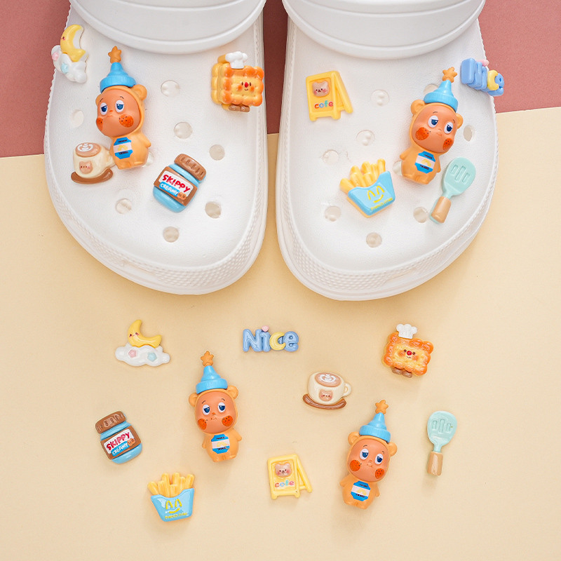 Phụ kiện giày lỗ Pop Mart Bơ đậu phộng Starman Khóa giày Thích hợp cho Crocs Khóa giày giác quan cao cấp có thể tháo rời Khóa giày lỗ Khóa giày Busch Khóa giày Zhibixing ins Hoa giày