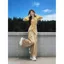 Phong cách Trung Quốc mới Không đều sang trọng Áo chéo viền loe tay áo nữ phù hợp với eo co giãn Quần ống rộng Bộ đồ hai mảnh