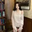 Áo kiểu Hot Girl kiểu dáng nhẹ trong suốt dành cho nữ mùa hè 2026 Phong cách mới Vai chéo dáng rộng Niche dài tay T-