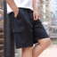 Quần short chở hàng màu trơn nhẹ mùa hè dành cho nam, Quần short thể thao dáng rộng cỡ lớn