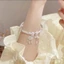 Vòng tay dây thổ cẩm màu hồng phong cách Hàn Quốc. Thiết kế nhỏ, tinh tế với khóa điều chỉnh an toàn
