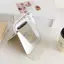 Gương trang điểm gấp đôi chó đeo kính khung xanh