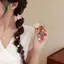 Dây buộc tóc nữ có chi tiết ngọc trai và thiết kế dây điện thoại để co giãn và giữ tối đa