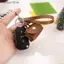 Móc khóa túi xách Mini SRVN Kawaii có da PU Hoàn hảo để lưu trữ tiền xu Phong cách thời trang sang trọng.