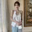 Mùa hè 2026 Phong cách mới Satin Camellia Camisole Thiết kế Niche Pháp Áo khoác ngoài không tay quây Top