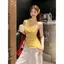 Áo yếm cổ xoay màu vàng ngọt ngào Hàn Quốc dành cho nữ mùa hè phong cách mỏng rỗng không đều đẹp tinh tế hàng đầu