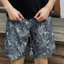 Quần short đi biển in họa tiết lá mùa hè dáng rộng thời trang nam quần short đi biển thông thường
