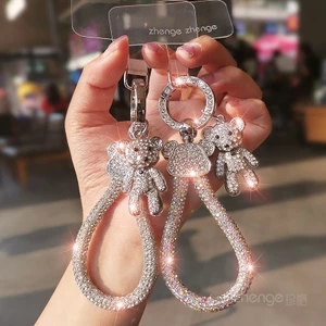 Xoay Điện Thoại Di Động Dây Loại Nhẫn ins Nữ Siêu Đẹp Full Kim Cương Gấu Mặt Dây Chuyền Túi Mặt Dây Chuyền Du Lịch Ngoài Trời