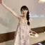 Đầm dây buộc hoa nữ mùa hè Phong cách nhẹ nhàng Tính khí không đều Niche Slimer Look Váy dài chữ A