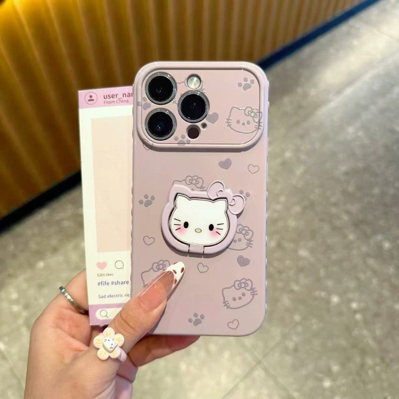 Vỏ điện thoại iPhone giá đỡ ba chiều Hello Kitty Vỏ cao su mềm mặt trái iPhone - 11/12/13/14/15/16/17/Plus/Air/Pro/Max