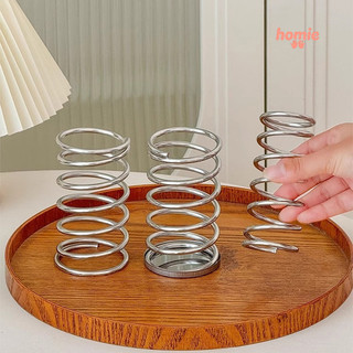 Giá đựng cọ trang điểm để bàn bằng sắt, có lỗ thoát nước, dạng khoét rỗng.