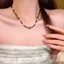 Vòng cổ phong cách Trung Quốc với đá ngọc trai và hạt xương đòn, thiết kế Tây Tạng