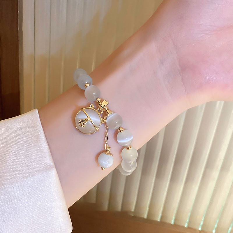 Vòng tay đính cườm đá mắt mèo may mắn dành cho nữ