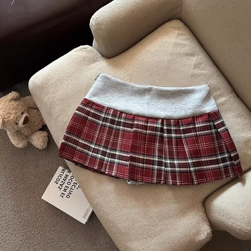 Váy chữ A preppy màu sắc tương phản, kẻ sọc thấp eo thêu xếp ly, phong cách mới Y2K