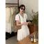 Váy trắng dịu dàng ngọt ngào Váy cổ chữ V khí chất Nữ mùa hè Pháp Váy ngắn nghỉ trà