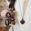 Mới Phong Cách Trung Hoa Màu Nâu Mặt Dây Chuyền Áo Len Dây Xích Nữ Retro Phong Cách Dân Tộc Dài Vòng Cổ Niche Zen Cao Cấp Cảm Giác