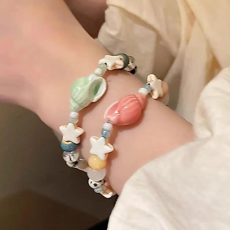 Vòng tay đính cườm hình ngôi sao và ốc sên, thiết kế sang trọng, phù hợp làm phụ kiện thời trang