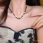 Vòng cổ phong cách Trung Quốc với đá ngọc trai và hạt xương đòn, thiết kế Tây Tạng