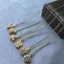 Mới Hợp Thời Trang Xoay Bốn Lá Cỏ Ba Lá Micro Kẻ Sọc Zircon Mặt Dây Chuyền Vòng Cổ Niche Ánh Sáng Sang Trọng Phù Hợp Với Xương Đòn Dây Chuyền Không Phai Màu 2026 @ -