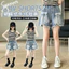 Bé Gái Nailed Denim Quần Short Mùa Hè 2026 Phong Cách Mới Trẻ Em Nơ Frayed Quần Ba Điểm