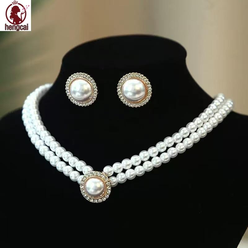 Bộ trang sức ngọc trai thanh lịch cho bé gái gồm bông tai, vòng cổ và vòng tay