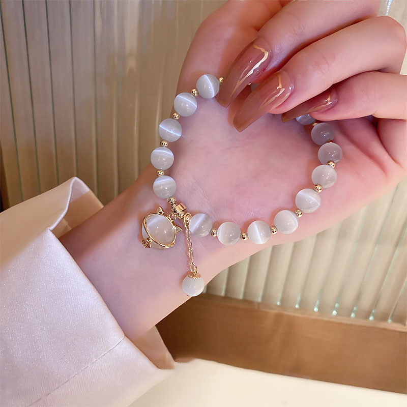 Vòng tay đính cườm đá mắt mèo may mắn dành cho nữ