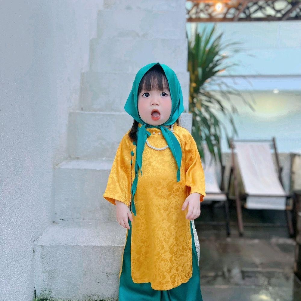 Áo dài Tết Gấm cổ kiểu lệch đính ngọc cho bé