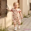 Áo liền quần bé gái mùa hè Puff tay ngắn cổ búp bê Bộ áo liền quần in hình dâu tây dễ thương