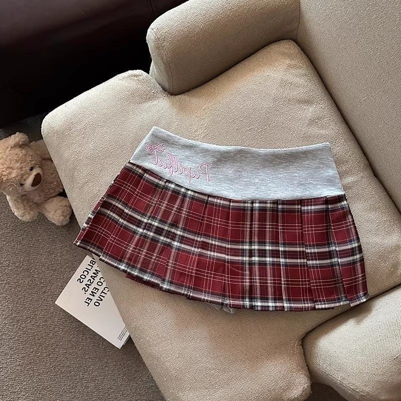 Váy chữ A preppy màu sắc tương phản, kẻ sọc thấp eo thêu xếp ly, phong cách mới Y2K