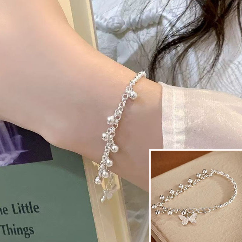 Vòng tay thời trang bướm kết hợp với mặt dây chuyền, trang sức tinh tế.