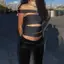 Mùa hè 2026 Trailing Sister Hot Girl Rỗng xiên Vai Áo Vest Thiết kế bất đối xứng Slim fit Crop Ngắn Niche Slimer Look Áo không tay Top Nữ