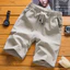 Quần Short Nam Vải Lanh Cotton Đi Biển Quần 2026 Màu Trơn Gian Hàng Năm Điểm Đi Biển Quần Short Thường Ngày NDSQ