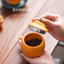 Hộp trà màu cam xấu xí Hộp đựng trà gia dụng Hộp đựng trà kín chống ẩm đánh thức Lon trà rỗng Lon đựng gốm nhỏ Sáng tạo hoặc