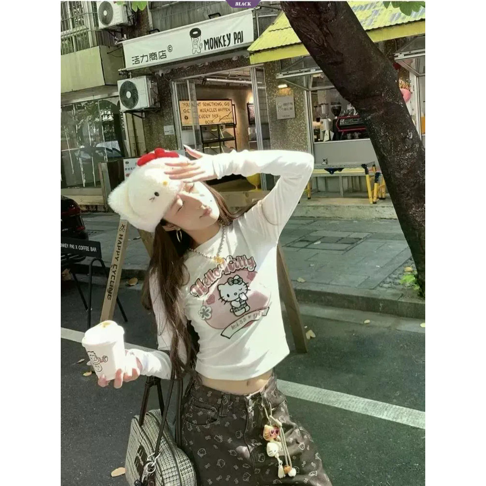 Hello Kitty áo thun dáng dài tay nữ mới, thiết kế ôm nhẹ và đáy áo rộng, phù hợp xuân thu
