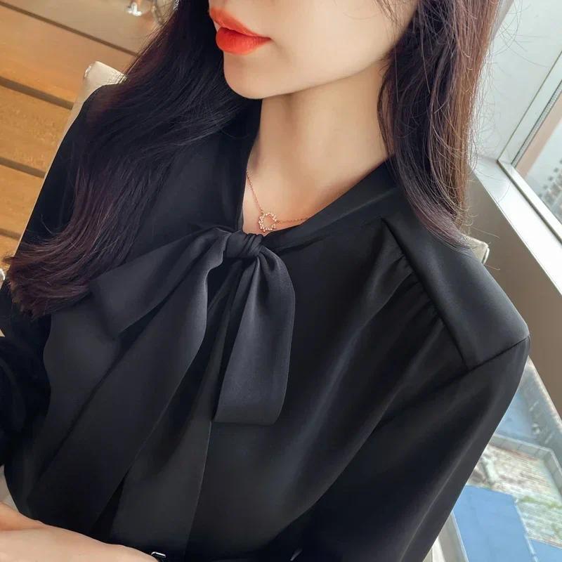 Áo sơ mi thu đông nữ phong cách Hàn Quốc, chất liệu satin với nơ đen.