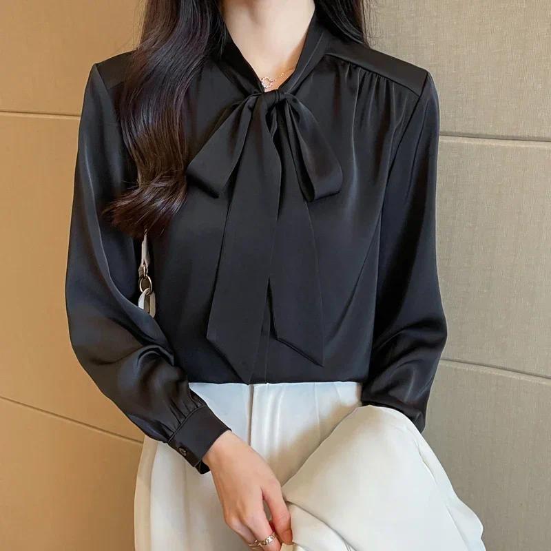 Áo sơ mi thu đông nữ phong cách Hàn Quốc, chất liệu satin với nơ đen.