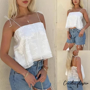 Áo Babydoll Y2K cho phụ nữ với thiết kế spaghetti dây, thêu và chi tiết ruffle peplum, phù hợp mùa hè.