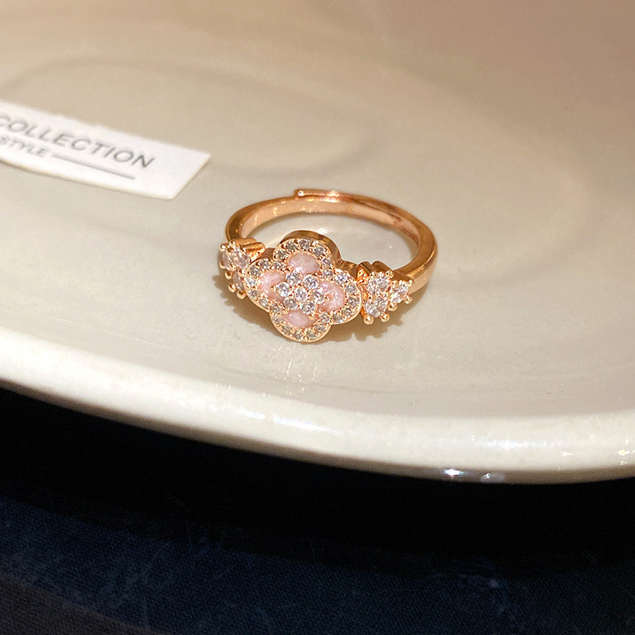 Nhẫn zirconia hoa mở điều chỉnh thiết kế xếp chồng tối giản, phù hợp làm món quà trang sức cho nữ.