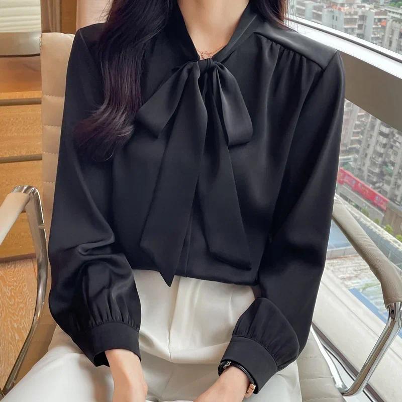 Áo sơ mi thu đông nữ phong cách Hàn Quốc, chất liệu satin với nơ đen.