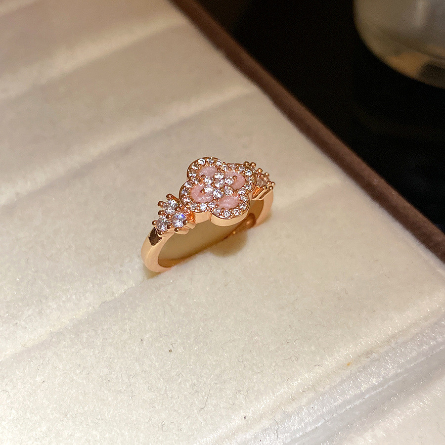 Nhẫn zirconia hoa mở điều chỉnh thiết kế xếp chồng tối giản, phù hợp làm món quà trang sức cho nữ.