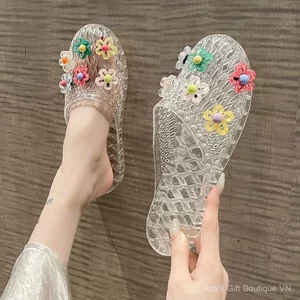 Dép nữ thạch Hàn Quốc Phiên bản Hàn Quốc Trang phục ngoài thời trang Baotou Flat Phụ kiện hoa trong suốt đi biển