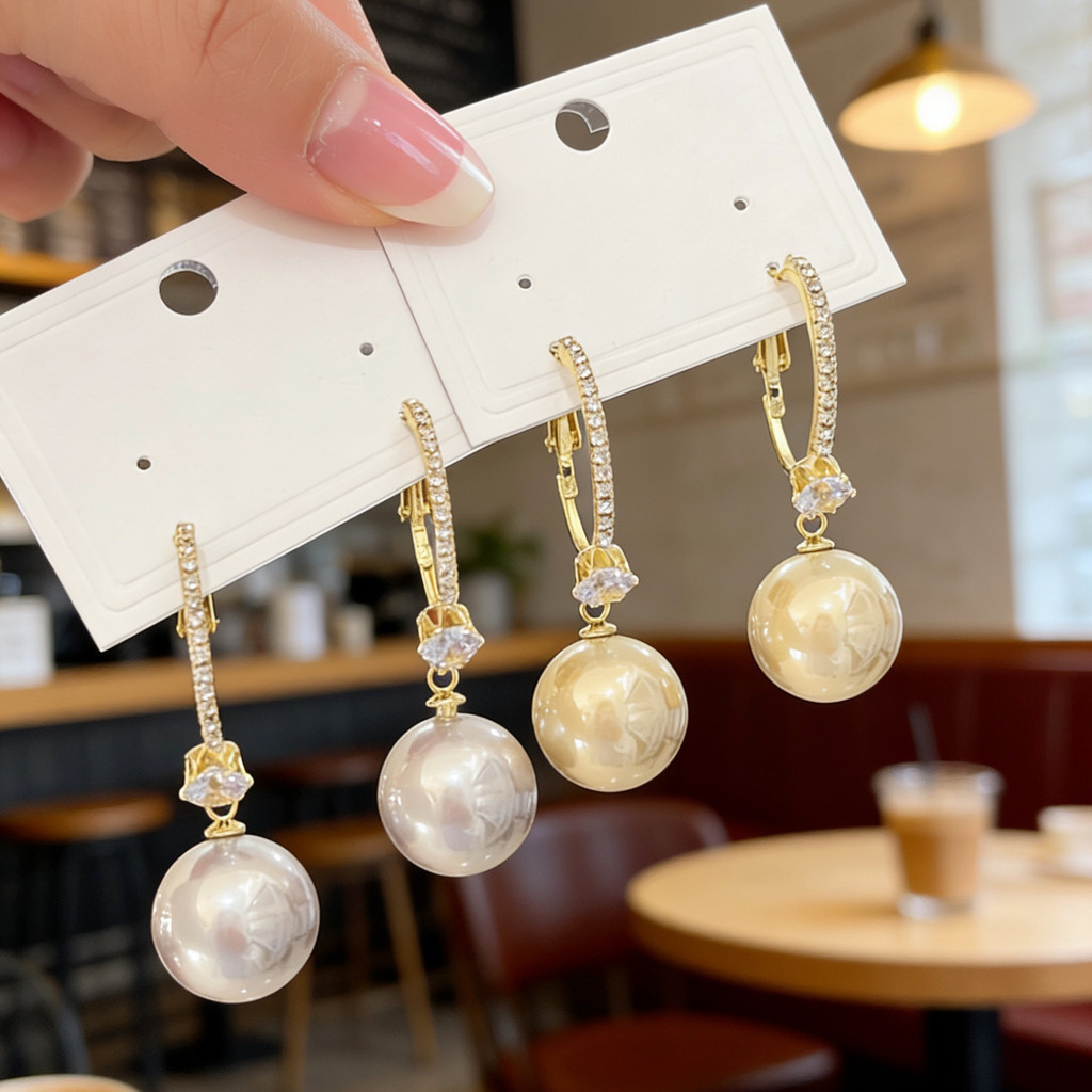 Trang sức thời trang nữ: Bông tai nơ ngọc trai với chi tiết zirconia tinh xảo