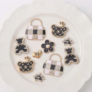 Set Charm Gấu Tiểu Thư Đính Đá Sang Trọng – Gấu Nơ Đen, Túi Caro, Vương Miện Luxury