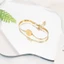 Vòng tay nữ đàn hồi vàng thời trang, thép Titan bền màu, phù hợp nhiều phong cách
