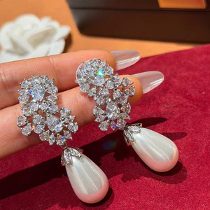 Bông tai tua rua zircon ngọc trai với thiết kế ánh sáng hoa, phong cách sang trọng mới nhất