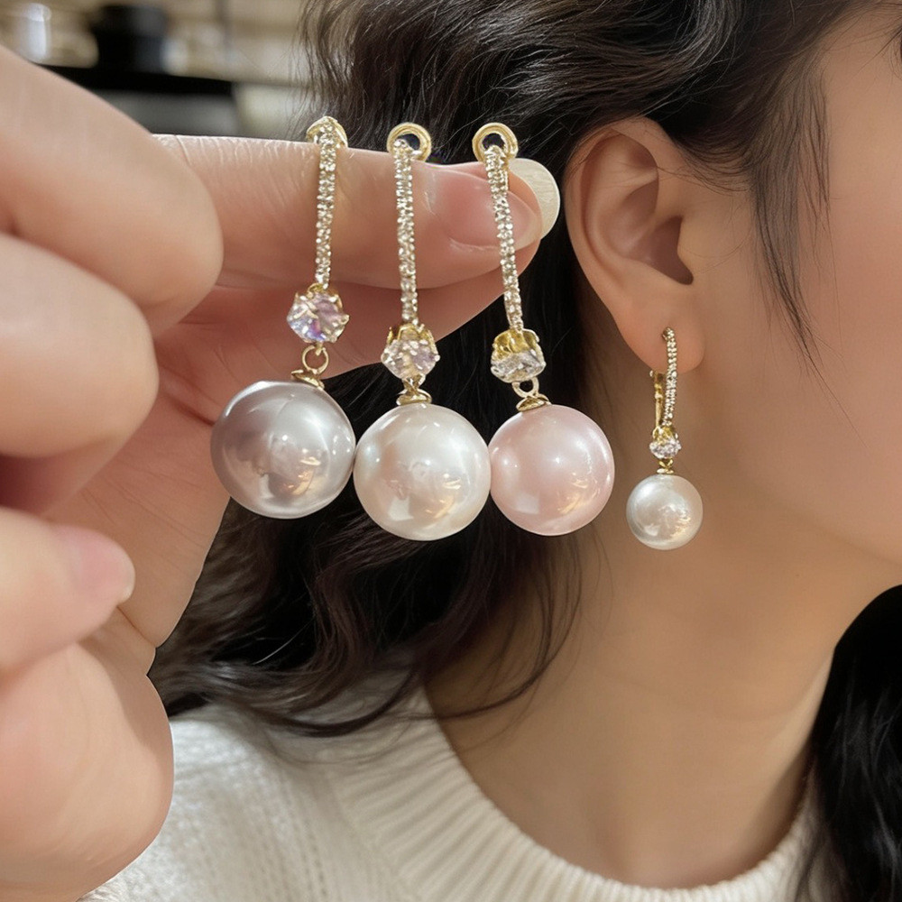 Trang sức thời trang nữ: Bông tai nơ ngọc trai với chi tiết zirconia tinh xảo