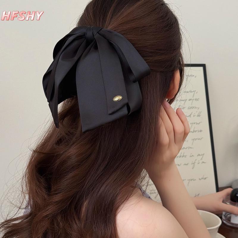 Kẹp tóc satin nơ đuôi ngựa sang trọng, phù hợp cho nữ và cô gái với thiết kế tinh tế.
